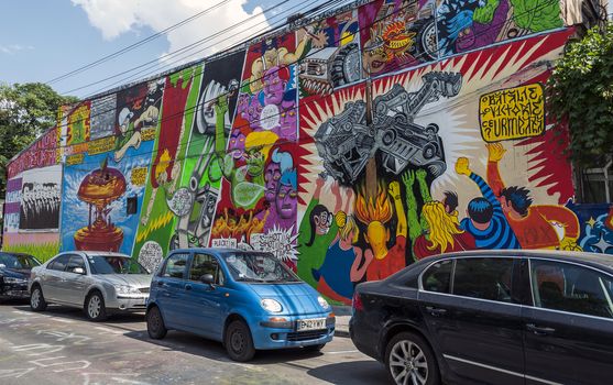 BUCHAREST - JUNE 21: Graffiti by unknown artists on Arthur Verona - Painter street done as part of the Street Delivery 2013, on June 21, 2013 in Bucharest, Romania