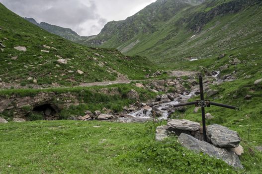 Beautiful mountains landscape in Carpathian on the Transfagarasan road with a cross of a man.