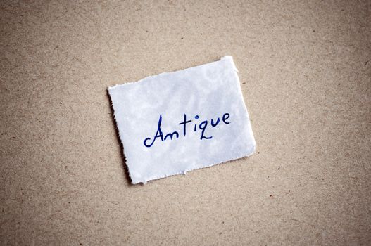 Antique message,written on piece of paper, on cardboard background. Space for your text.