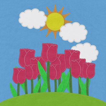 Tulip on green grass field with stitch style fabric background