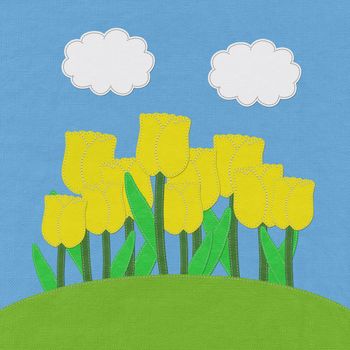 Tulip on green grass field with stitch style fabric background