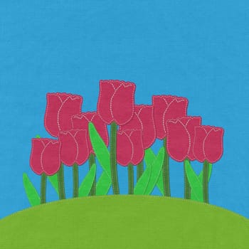 Tulip on green grass field with stitch style fabric background