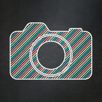 Tourism concept: Photo Camera icon on Black chalkboard background, 3d render