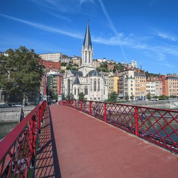 Lyon city with red footbridge on Saone river, France
