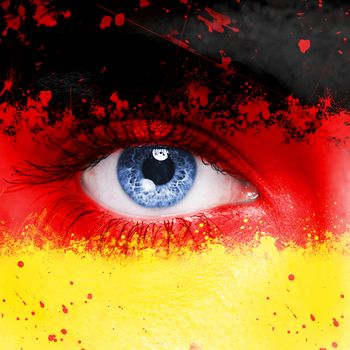Germany flag painted on woman face
