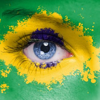 Brazil flag painted on woman face