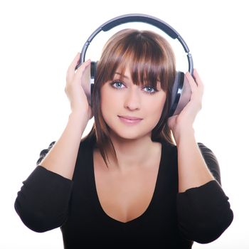 Beautiful girl in headphones over white background