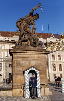 PRAGUE, CZECH REPUBLIC - MARCH 13th, 2014 - Soldier of elite Prague Castle Guard welcome you at the gates of Prague Castle.