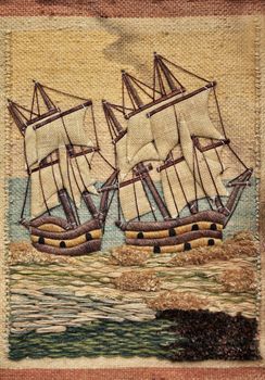 Background with embroidered sailboats at sea. Mauritius