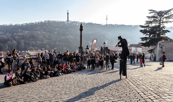 PRAGUE, CZECH REPUBLIC - MARCH 13th, 2014 - Street artist with violin on prague castle square
