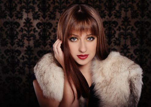 Beautiful woman in retro style over dark vintage background