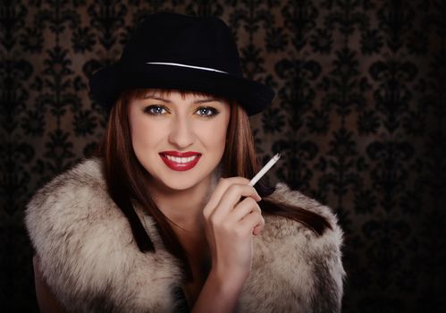 Beautiful woman in retro style over dark vintage background