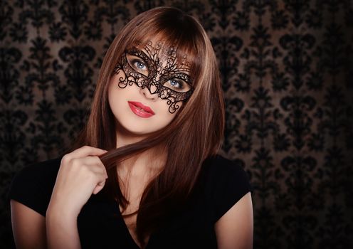 Beautiful woman in retro style over dark vintage background