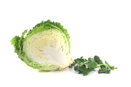 fresh green savoy cabbage halve on a bright background