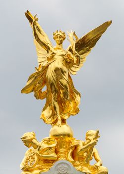 Gold statues on top of the Queen Victoria Memorial in London