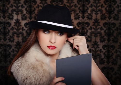 Beautiful woman in retro style over dark vintage background