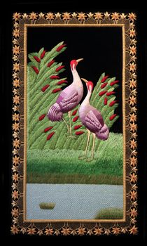Background with embroidered two birds. Mauritius