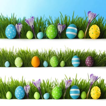 Collection of decorated easter eggs and flowers in grass with copy space