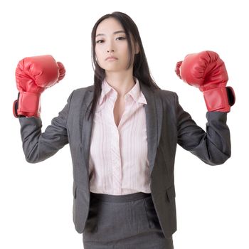 Business woman with boxing gloves, closeup portrait.