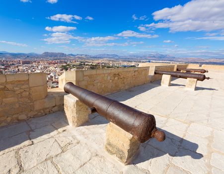 Alicante skyline and old canyons of Santa Barbara Castle in Spain