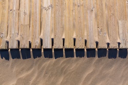 pine wood deck weathered in beach sand pattern texture detail