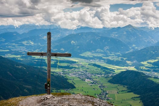 Large view of the high Alps in Austria with cross