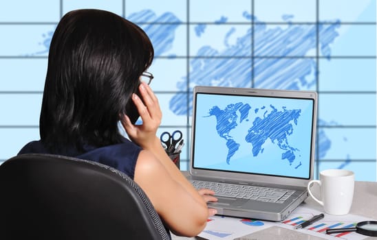 woman with laptop sitting in office