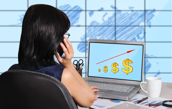 businesswoman and dollar chart on screen laptop sitting in office