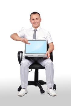 businessman sitting in chair and holding laptop