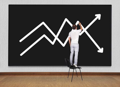 man standing on chair and drawing graph