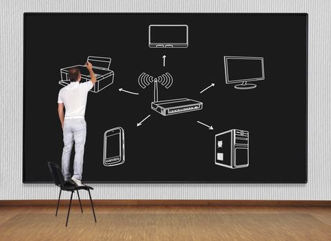 man standing on a chair and drawing computer network