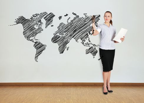 businesswoman in office drawing world map