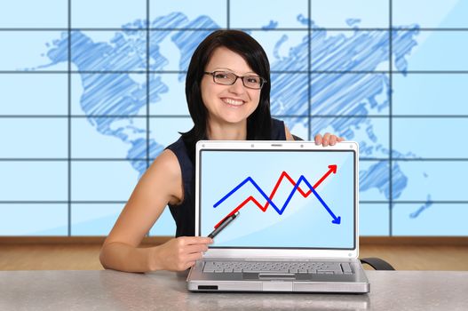 woman sitting in office and laptop with chart