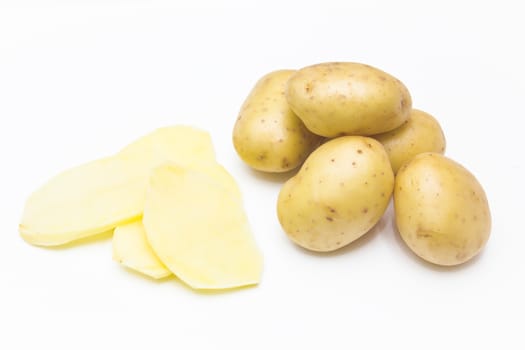 Fresh potatoes sliced on white background