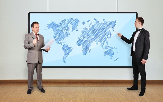 two businessman in office and world map on plasma panel