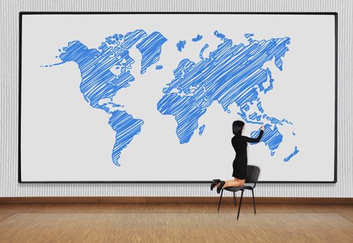 woman standing on a chair and drawing world map
