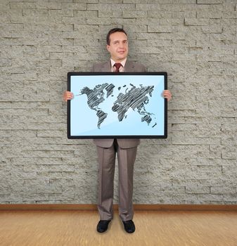businessman in room holding plasma with world map