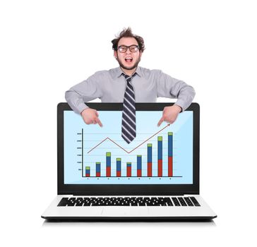 happy businessman pointing to laptop with chart