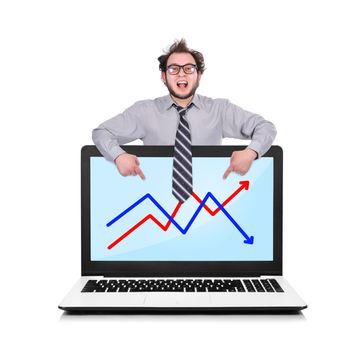 happy businessman pointing to laptop with chart