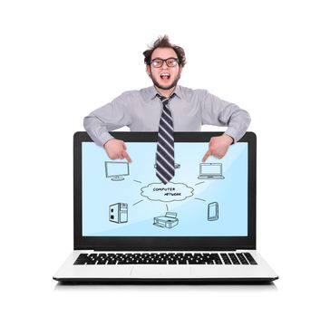 happy businessman pointing to laptop with computer network