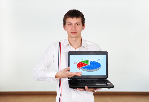 boy holding laptop with business chart