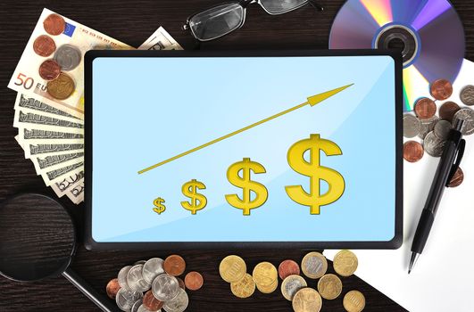 Modern business workplace: tablet with dollar chart