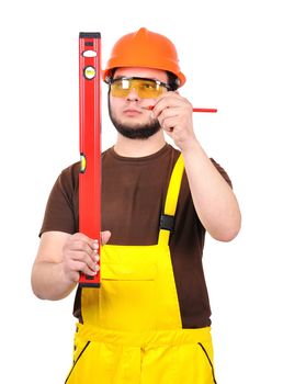 builder holding wasserwaage and pencil  on a white background