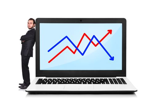 Businessman leaning on a laptop with chart