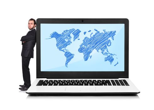 Businessman leaning on a laptop with world map