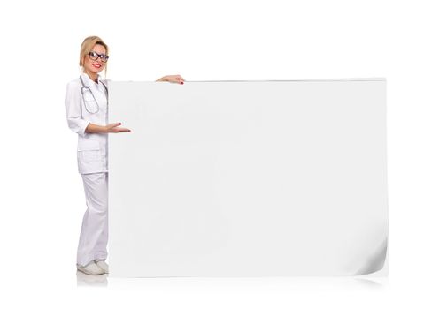 young female doctor holding big blank poster