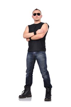 portrait of rocker boy standing with arms folded