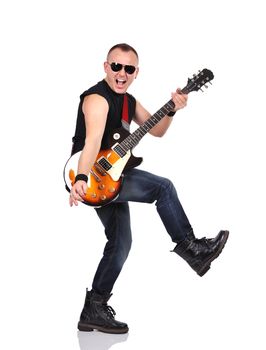 rock musician is playing on electrical guitar