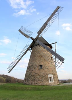 Separate ancient old windmill at rural landscape.