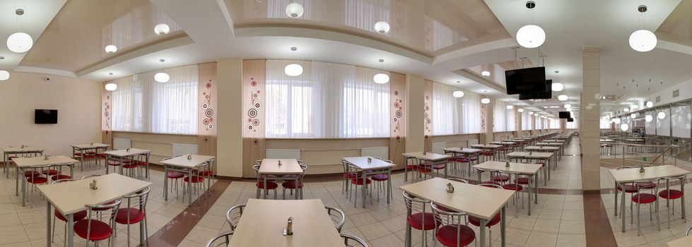 panorama of big cafe with a set of little tables